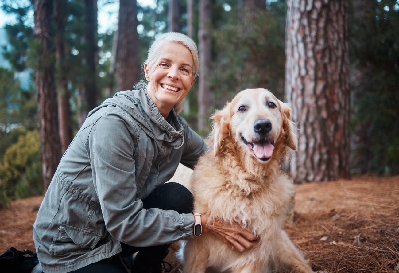 woman hugging dog